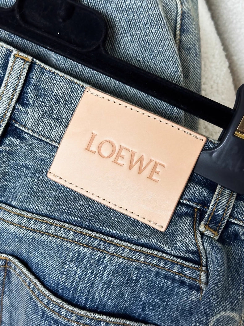 Loewe light blue washed distressed denim trousers