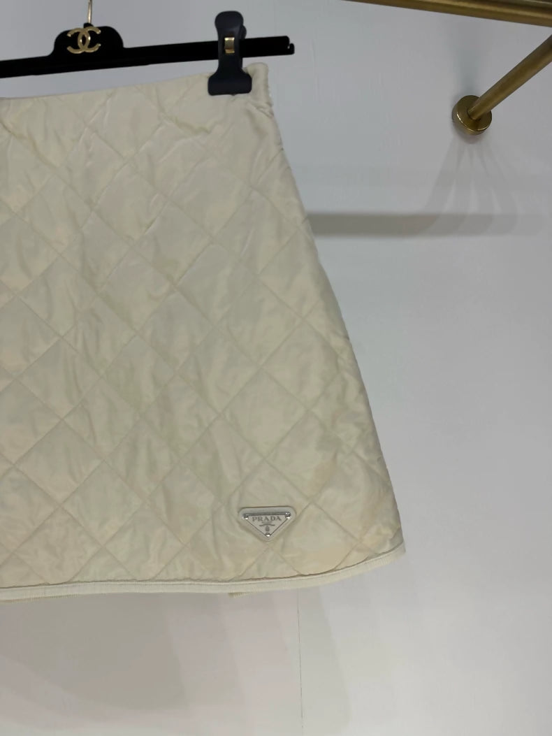 Prada 2025 skirt in cream white nylon with diamond pattern and triangular logo