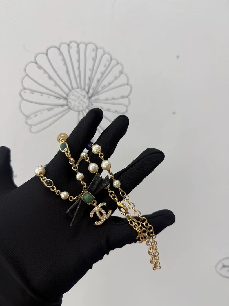 Chanel Pearl Leather Bow Necklace