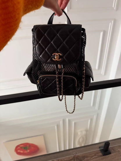 Chanel 25S black mesh backpack in gold hardware