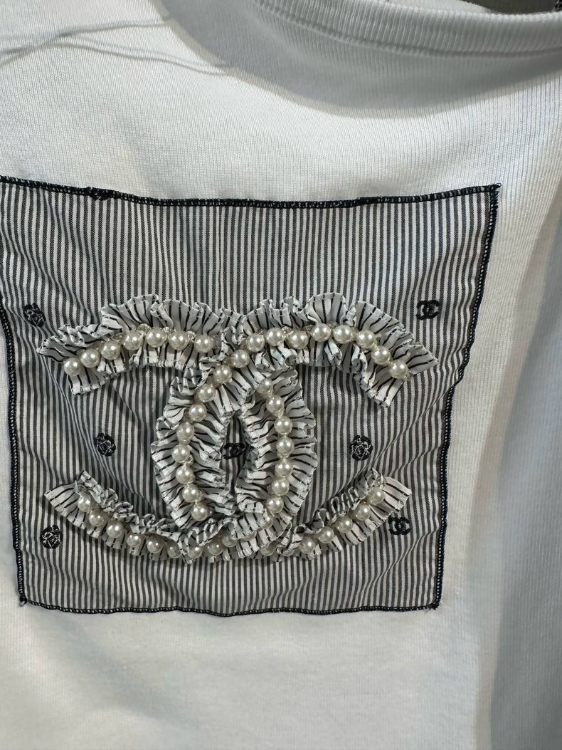 Chanel 24P white pearl logo off-shoulder top