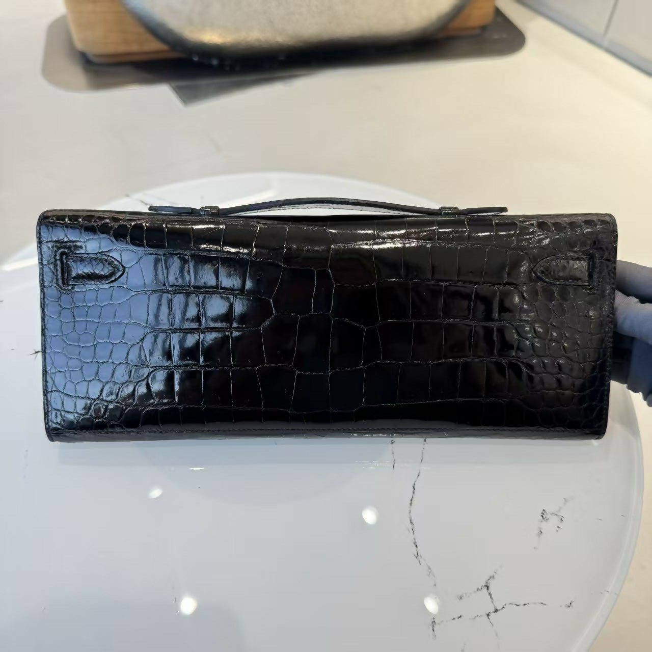 Hermes Kelly cut black shiny crocodile leather palladium hardware