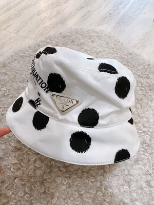 Prada black and white polka dot bucket hat with triangular logo