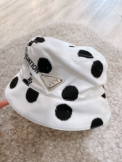 Prada black and white polka dot bucket hat with triangular logo