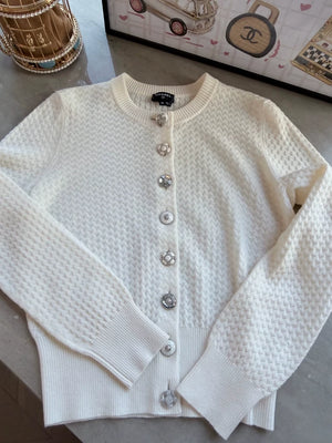 Chanel 24A white cashmere cardigan with charms buttons