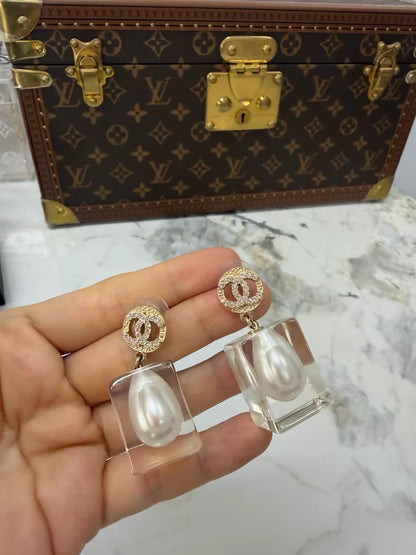Chanel 19K gold pearl and acrylic earrings