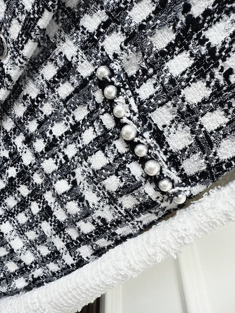 Chanel 25P black and white tweed jacket with pearl stitching