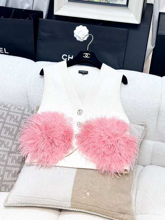 Chanel Fall/Winter 2023, white cashmere vest with pink ostrich feather