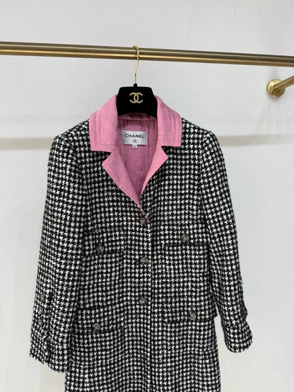 Chanel 24A long coat with black and white houndstooth pattern and pink silk lining