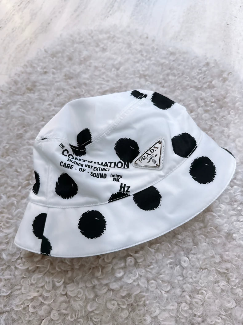 Prada black and white polka dot bucket hat with triangular logo