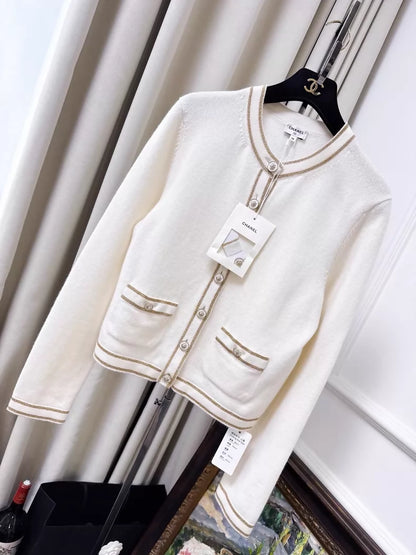 Chanel 26c white knit cardigan with gold trim and two pockets