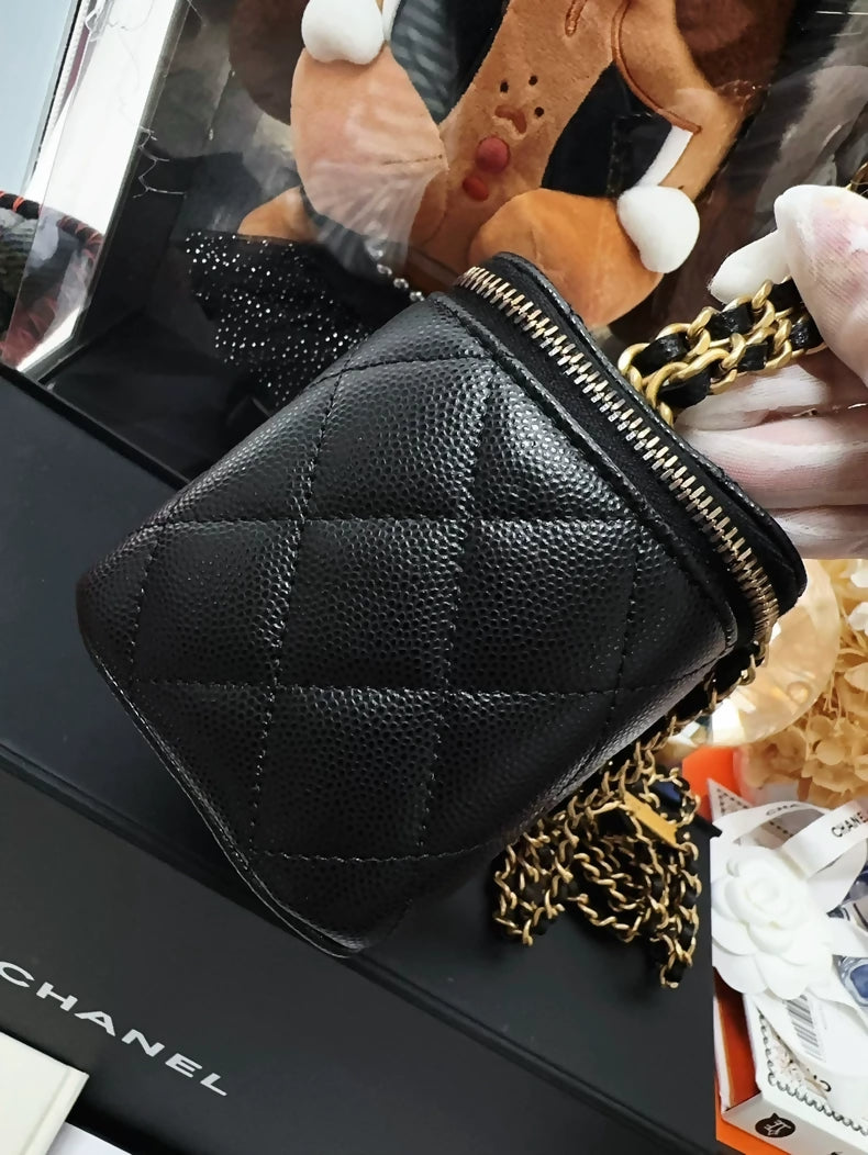 Chanel 23B black and gold lychee leather vanity bag with letter chain strap