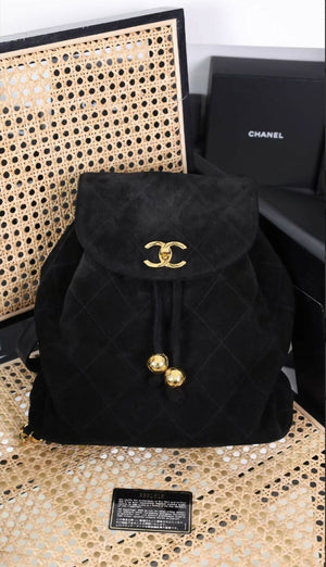 Chanel black sued backpack with gold hardware