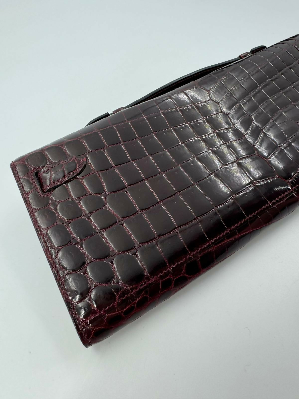 Hermès Kelly Cut Bag in Bordeaux Shiny Porosus Crocodile Leather with PHW