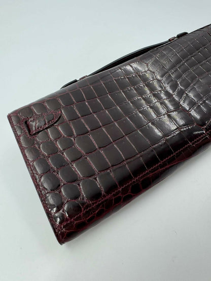 Hermès Kelly Cut Bag in Bordeaux Shiny Porosus Crocodile Leather with PHW