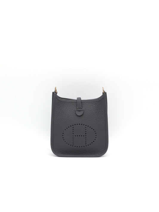 Hermès Evelyne crossbody bag in dark grey grained leather with perforated H cut-out and gold-tone hardware