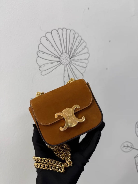 Celine
s new gold mini calfskin chain crossbody/shoulder bag with gold hardware.