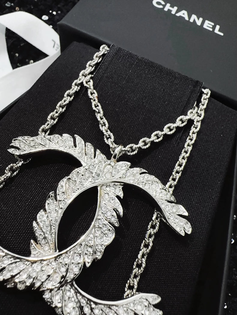 Chanel 25S double C logo feather