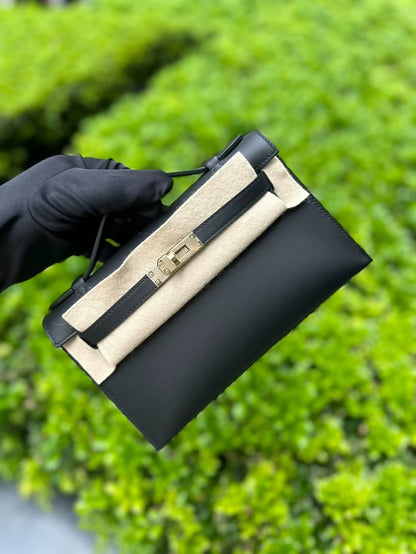 Hermès Kelly pochette black swift leather with light gold hardware