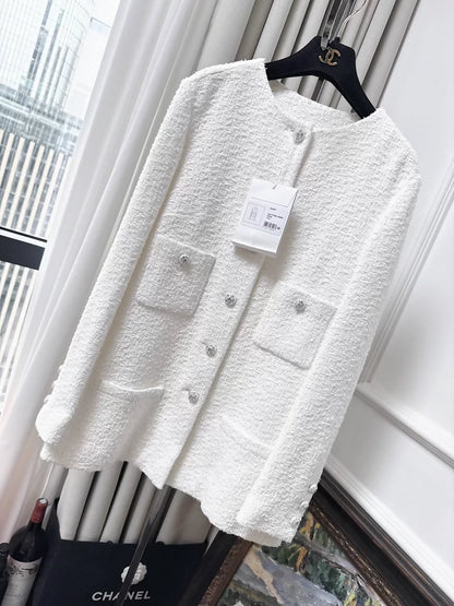 Chanel 23s jacket in white tweed with rhinestone buttons