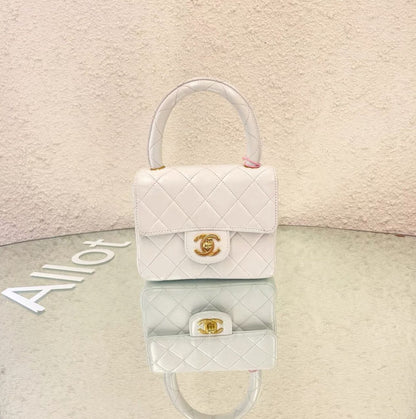 CHANEL Chanel White Quilted Lambskin CC Top Handle Mini Kelly Bag Gold Hardware, 1994 - One size Clutch Bag - Secondhand luxury from Wararni