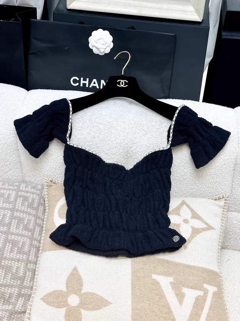 Chanel 21P off-the-shoulder top in dark blue gold chain leather
