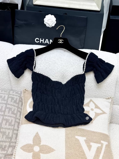Chanel 21P off-the-shoulder top in dark blue gold chain leather