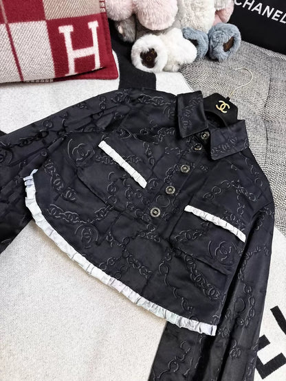 Chanel 22s black embossed double C logo jacket with purple gradient silk trim and two pockets