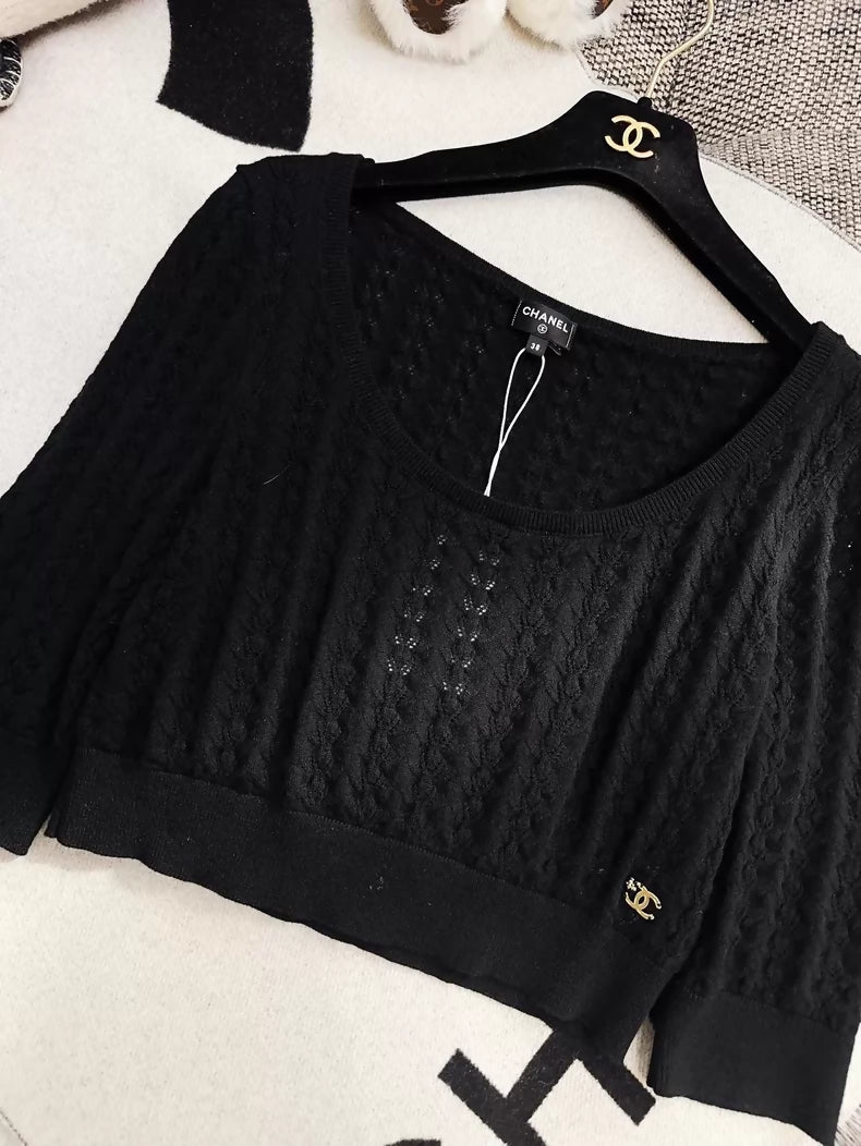 Chanel 24b black floral knit top with a large neckline