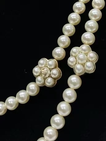 Chanel's multi-layered pearl floral design exudes elegance and sophistication