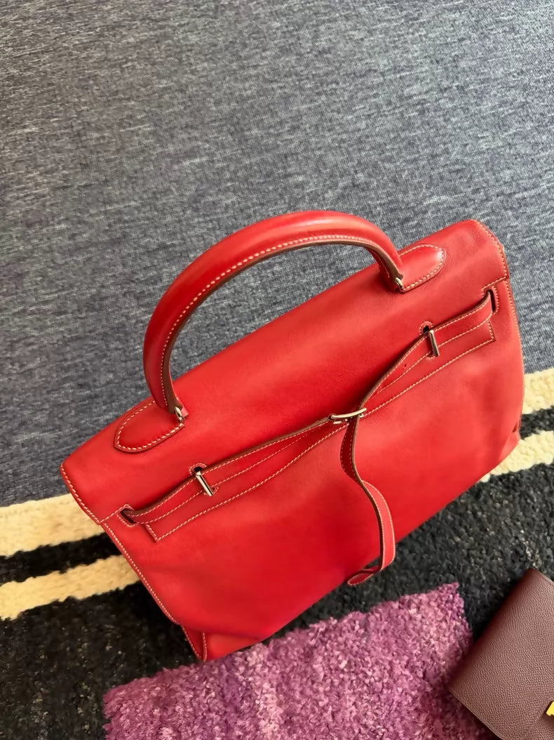 Hermes Flat Kelly 35 in red with white stitching.
