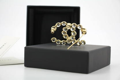Chanel A24S Acrylic CC Champagne Gold Transparent Brooch