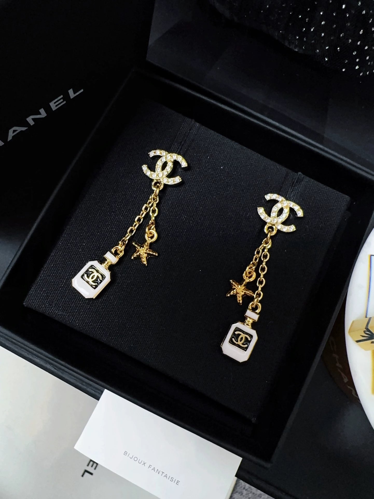 Chanel 25c perfume bottle star earrings