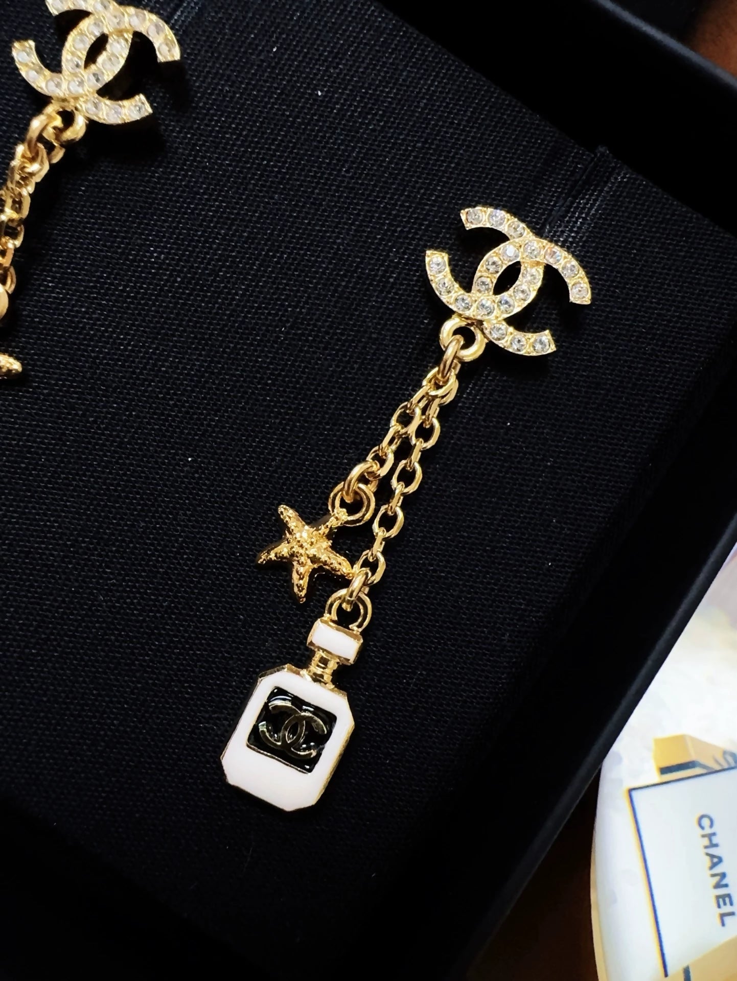 Chanel 25c perfume bottle star earrings