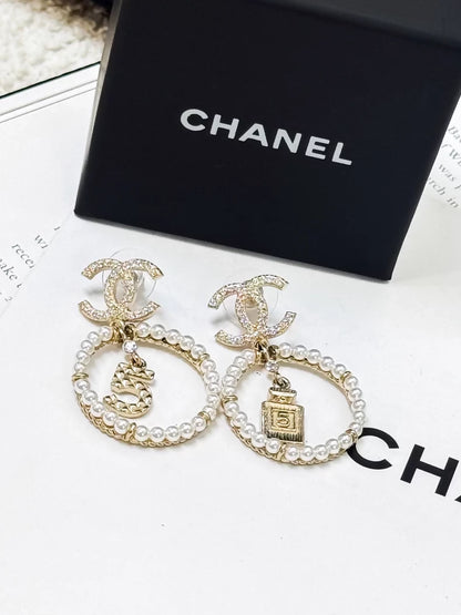 Chanel gold circle pearl pendant earrings