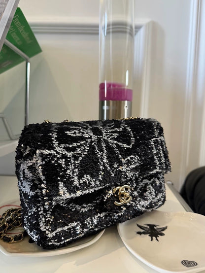 Chanel 24B bow black and white sequined mini flap bag CF