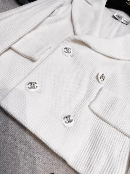 Chanel 21C white tweed jacket with rhinestone buttons