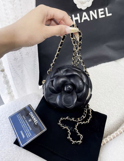 Chanel black camellia round chain bag