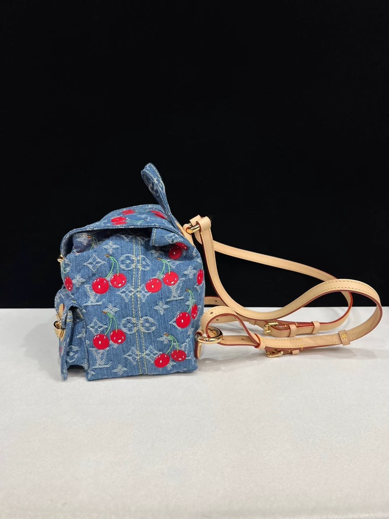 Louis Vuitton Takashi Murakami collaboration cherry denim backpack