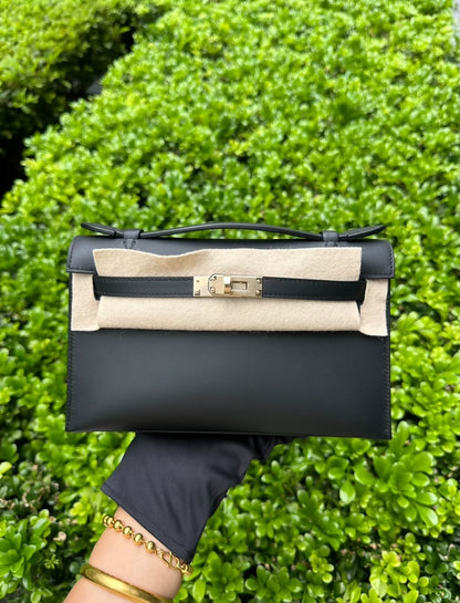Hermès Kelly pochette black swift leather with light gold hardware