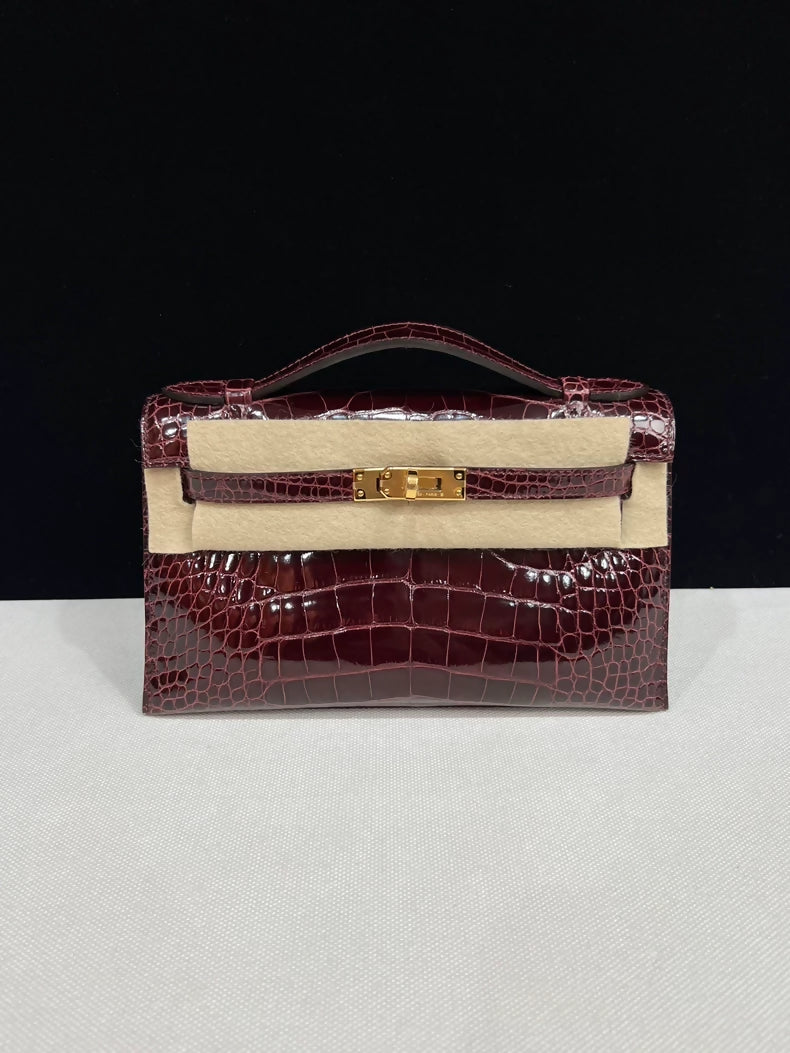 Hermes kelly Pochette Bordeaux Shiny Crocodile Leather Gold Hardware