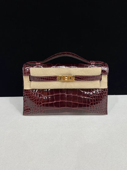 Hermes kelly Pochette Bordeaux Shiny Crocodile Leather Gold Hardware