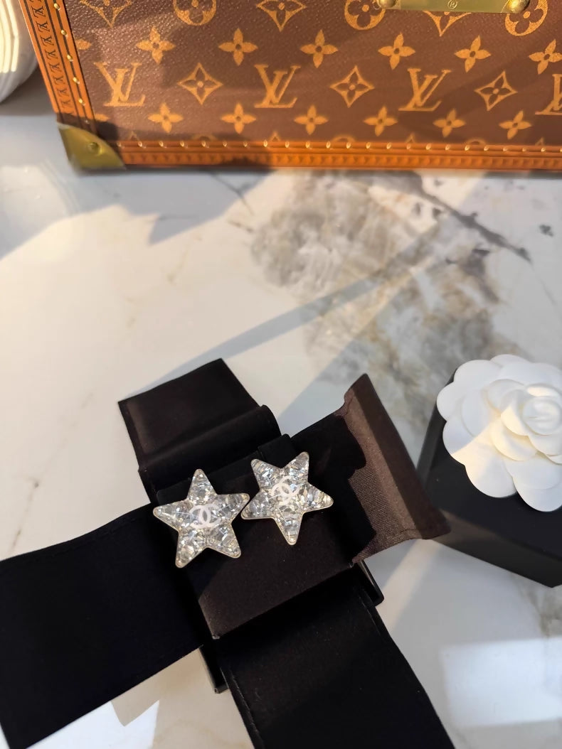 Chanel 25c double C acrylic star silver earrings