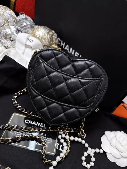 Chanel 22S black and gold quilted heart-shaped crossbody bag