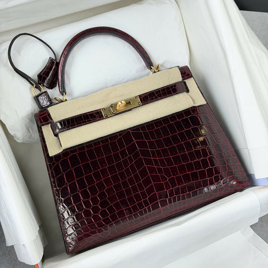 Hermès Kelly Sellier 28 Bordeaux Shiny Porosus Crocodile with Gold Hardware