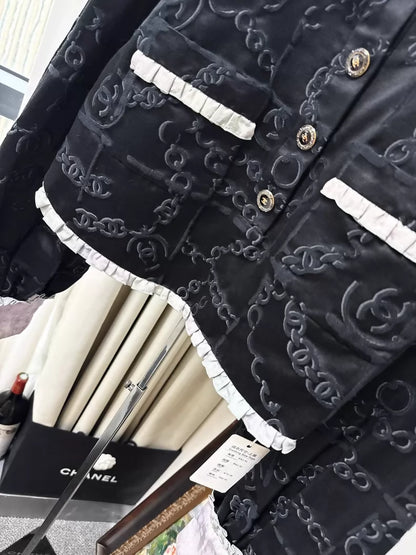 Chanel 22s black embossed double C logo jacket with purple gradient silk trim and two pockets
