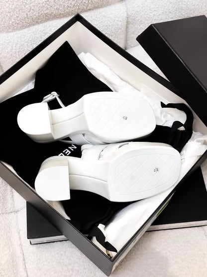 Chanel 23A white patent leather platform pumps