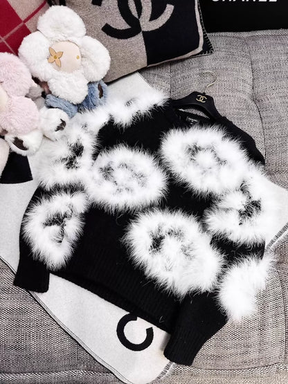 Chanel 23K white ostrich feather black camellia sweater