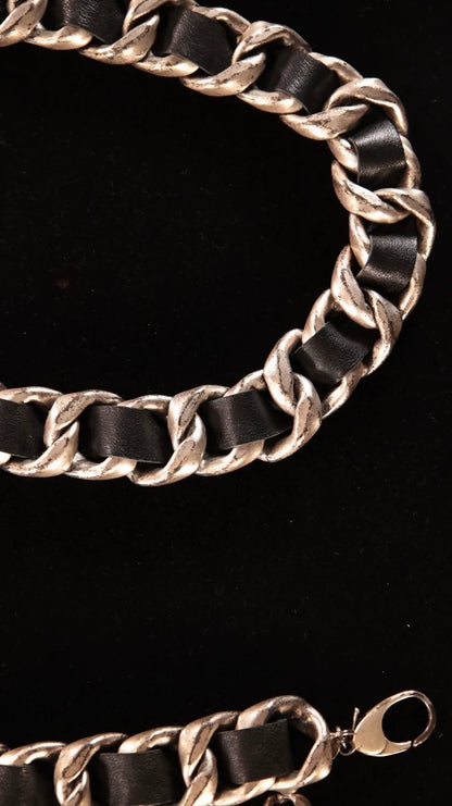 Chanel black and silver leather chain with a rhinestone CC pendant and double waist chain