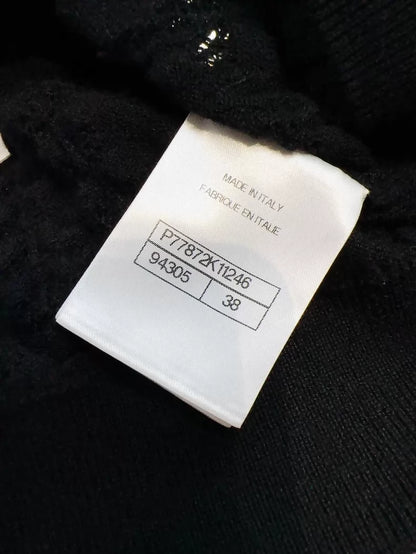 Chanel 24b black floral knit top with a large neckline